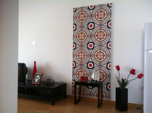 a living room with a wall with a wallpaper at A Casa Da Avenida in Madalena