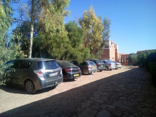 a row of cars parked in a parking lot at Dar Mouna in Aït Ben Haddou