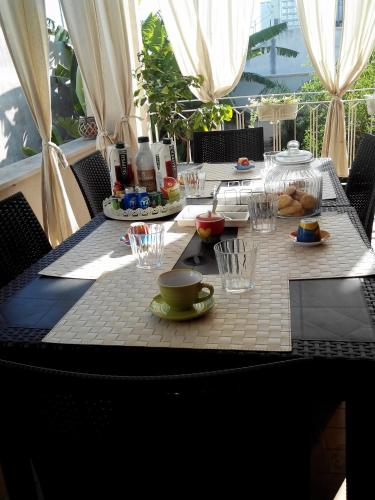 a table with a plate of food on top at Villa Lazzari B&B Tra i due Mari in Maglie