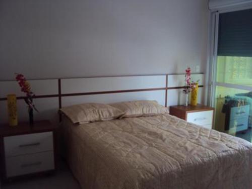 Cama ou camas em um quarto em Residencial Vila da Praia Apartamento 27