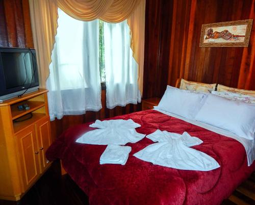 Cama ou camas em um quarto em Chale Bosque da Serra