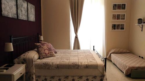 a bedroom with a bed and a window at Capital Flat 9/b in Rome