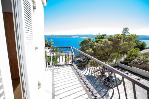 a balcony with a view of the water at Apartments Pušić in Omiš