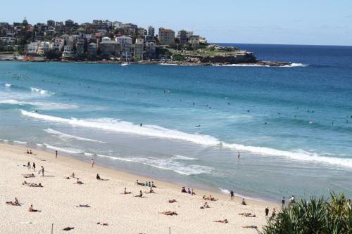 a beach filled with lots of people on a sunny day at Mrs Banks Hotel in Sydney