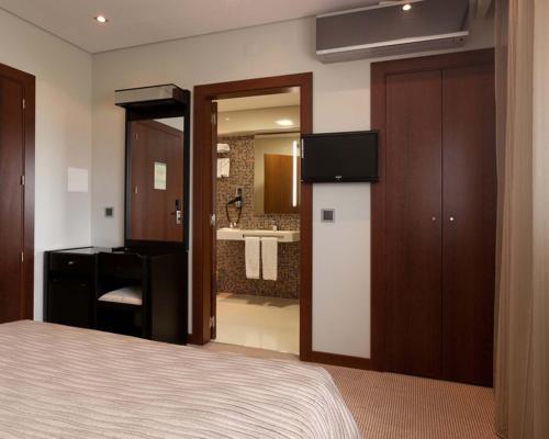 Postel nebo postele na pokoji v ubytování Cardal Hotel