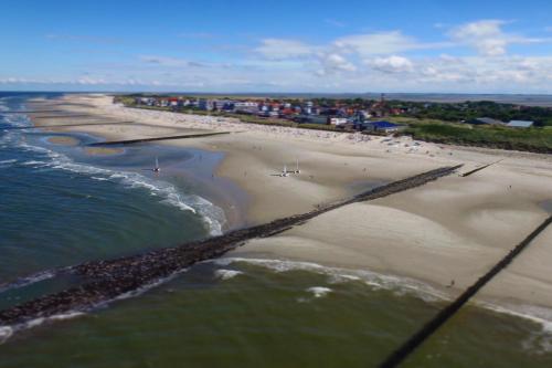 an aerial view of a beach and the ocean at Atlantic Hotel Garni in Wangerooge