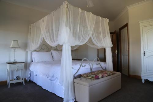 Ένα ή περισσότερα κρεβάτια σε δωμάτιο στο BellbirdHill Bed & Breakfast