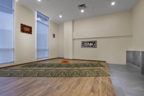 an empty room with a rug on the floor at Aston Batam Hotel & Residence in Nagoya