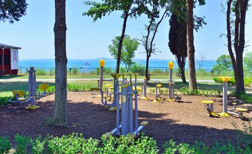 a park with a bunch of playground equipment at Sol Nessebar Mare All Inclusive in Nesebar