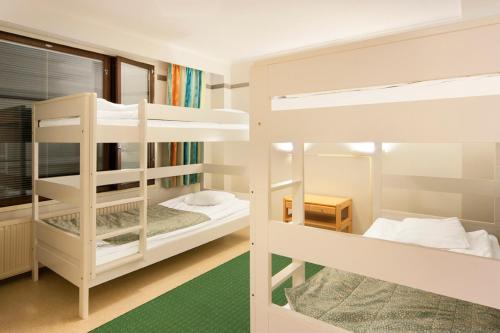 Säng eller sängar i ett rum på Spa Hotel Peurunka