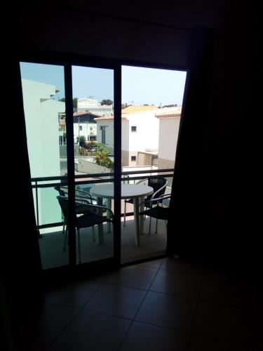 a view of a balcony with a table and chairs at Vilas Horizonte in Porto Santo