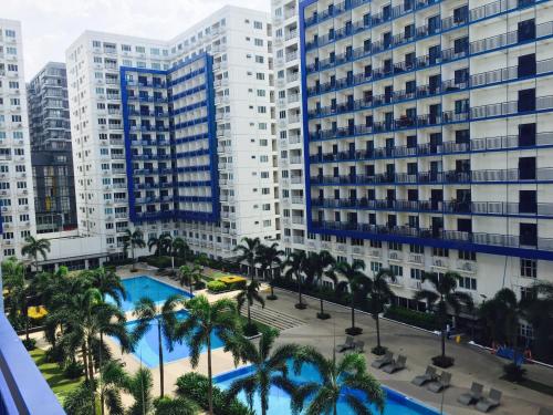 an aerial view of a city with tall buildings at Sea Residences MOA-Eric Apartments in Manila