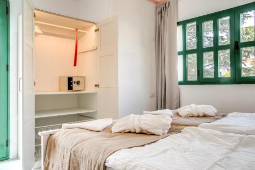 Säng eller sängar i ett rum på Hostal Alegre