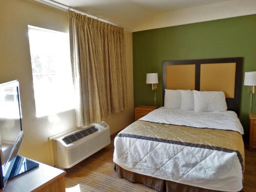 a hotel room with a bed and a desk at Extended Stay America Suites - Philadelphia - Malvern - Swedesford Rd in Malvern