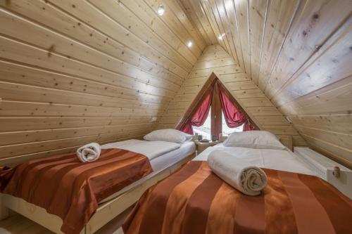 Säng eller sängar i ett rum på Apartamenty Na Szczytach Zakopane