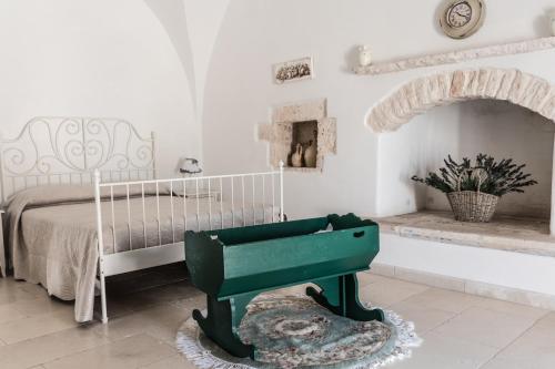 A bed or beds in a room at Masseria Luco