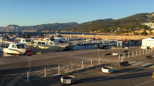 a bunch of boats docked in a harbor at Casa M&M in Cala Gonone