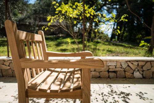 a wooden bench sitting on top of a patio at Domaine de Saint Clair in Aix-en-Provence