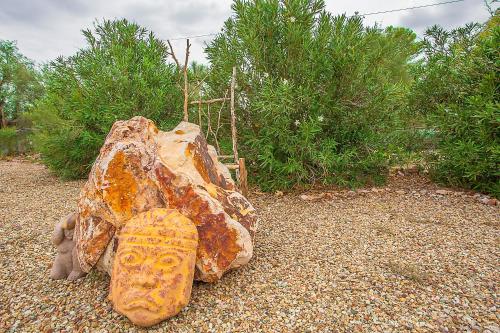 a rock with a shoe on top of it at My Place Suites in Wickenburg