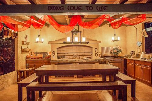 a kitchen with a table with a sign saying giving up to us at My Place Suites in Wickenburg