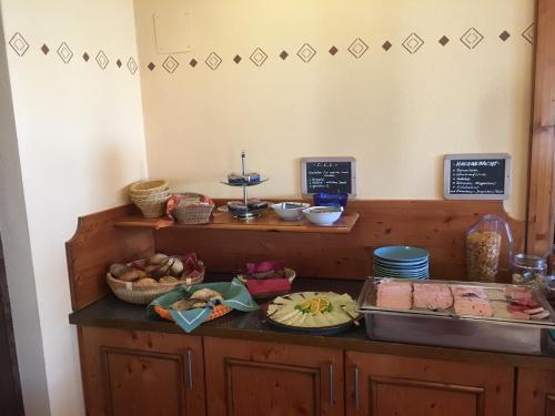 a counter with some food on top of it at Landhotel Sportalm in Philippsreut