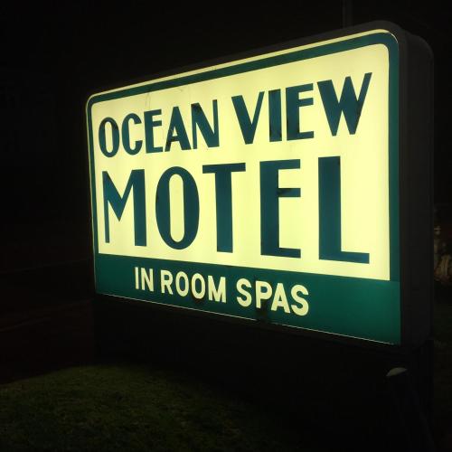 a sign that reads ocean view motel in room spaces at OceanView Motel in Huntington Beach