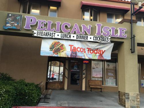a restaurant with a sign that reads pizza today at OceanView Motel in Huntington Beach