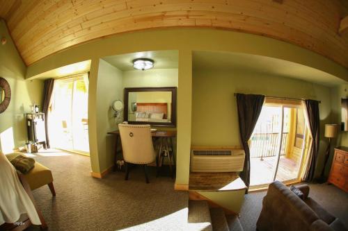 a room with a room with a desk and a room with a room at Roam Inn in Munising