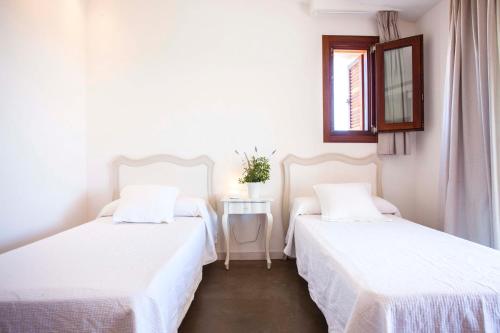 Postel nebo postele na pokoji v ubytování Can Corda Formentera