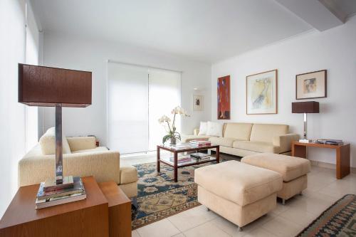 a living room with a couch and a table at 43 House Azores in Ponta Delgada