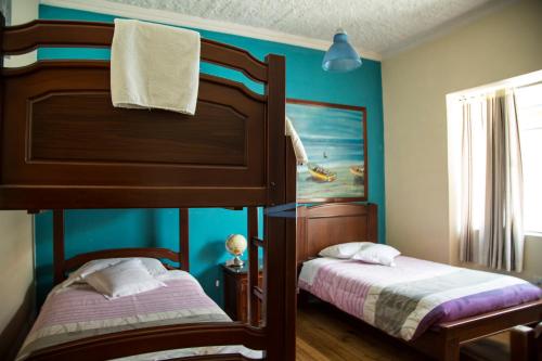 A bed or beds in a room at Posada Tambuca