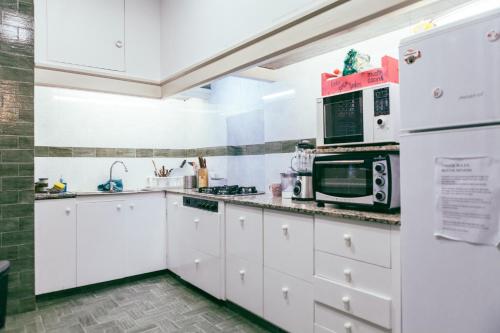 Η κουζίνα ή μικρή κουζίνα στο Mucha Masia Hostel Rural Urba