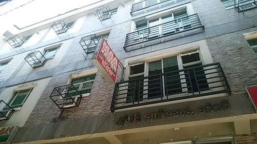 a building with balconies on the side of it at AAM Transient and Guest House in Manila
