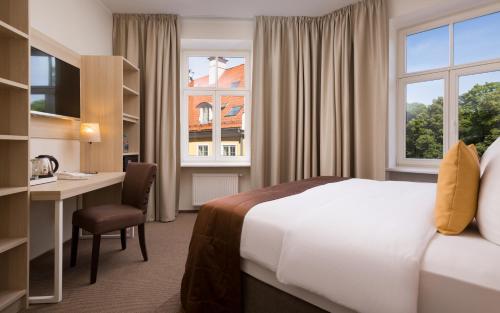 Postel nebo postele na pokoji v ubytování Radisson Hotel Old Town Riga