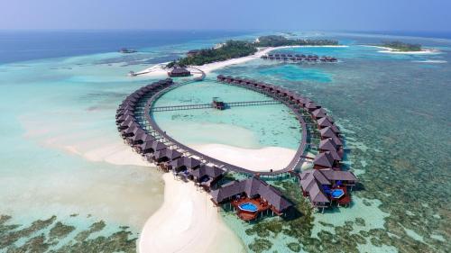 an island with a roller coaster in the ocean at Sun Siyam Olhuveli in South Male Atoll