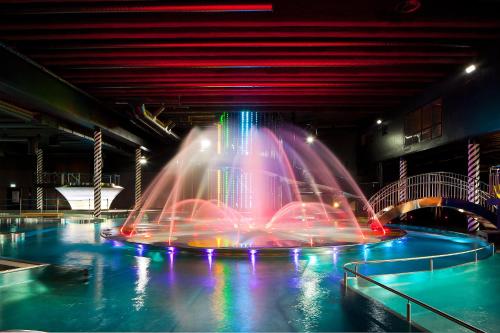 a fountain with colored lights in a building at SResort Family Apartment in Imatra