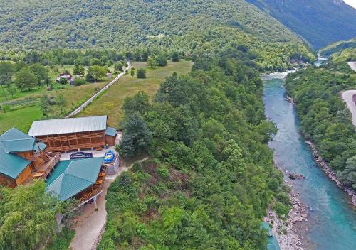 an aerial view of a train station next to a river at Rafting Blue River Tara in &Scaron;ćepan-Polje