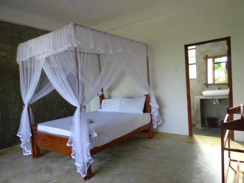 Postel nebo postele na pokoji v ubytování Nelu Villa Sigiriya