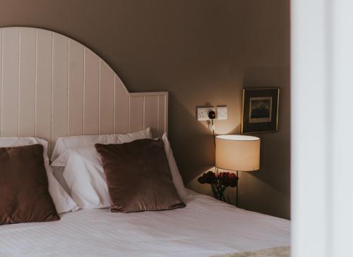 Ένα ή περισσότερα κρεβάτια σε δωμάτιο στο Healing Manor Hotel