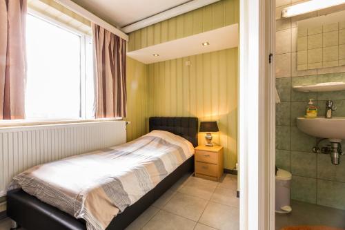 Koupelna v ubytování Arconaty Hotel
