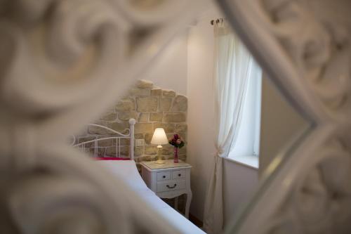 Postel nebo postele na pokoji v ubytování Villa Mediterranea - Garden Suite