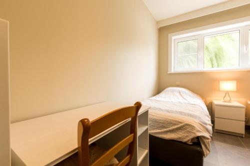 Una cama o camas en una habitación de Arconaty Hotel