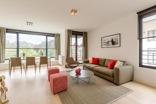 a living room with a couch and a table at The Livorno in Brussels