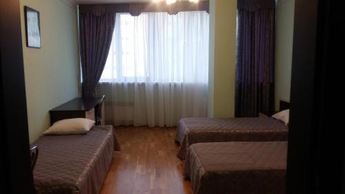 Postel nebo postele na pokoji v ubytování Hotel Obolon-Arena