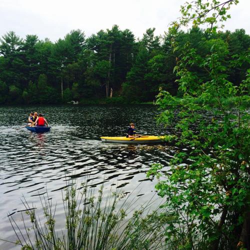 a group of people in kayaks on a lake at Clear Pond Getaway in Plymouth