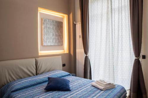 Postel nebo postele na pokoji v ubytování Torino Suite