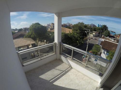 a balcony with a view of a city at Hotel Marlin Azul in Iriri