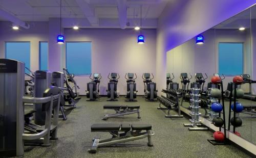 a gym with rows of exercise bikes and weights at Radisson Blu Mall of America in Bloomington