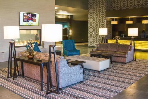 a lobby with couches and chairs in a hotel at River Bend Casino & Hotel in Wyandotte