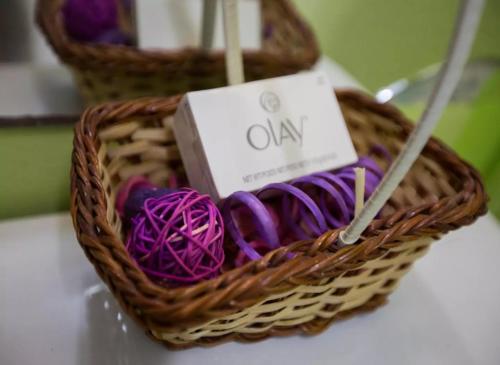 a wicker basket with purple yarn and a box at Serenity at the Oxford in Kingston